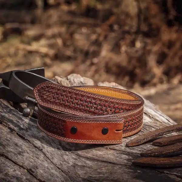 A brown full grain leather belt for men  featuring tooled basket weave pattern 
